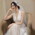 Low-cut lace gown, wedding dress....
