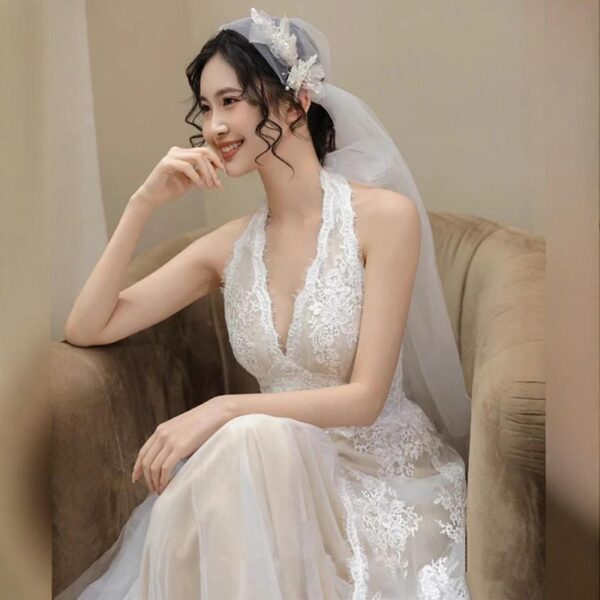 Low-cut lace gown, wedding dress....