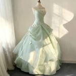 Off-the-shoulder full-length evening gown with a voluminous skirt