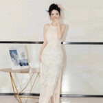 Silver form-fitting shimmering gown....