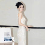 Silver form-fitting shimmering gown....