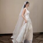 Low-cut lace gown, wedding dress....