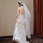 Low-cut lace gown, wedding dress....