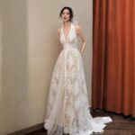 Low-cut lace gown, wedding dress....