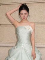 Off-the-shoulder full-length evening gown with a voluminous skirt