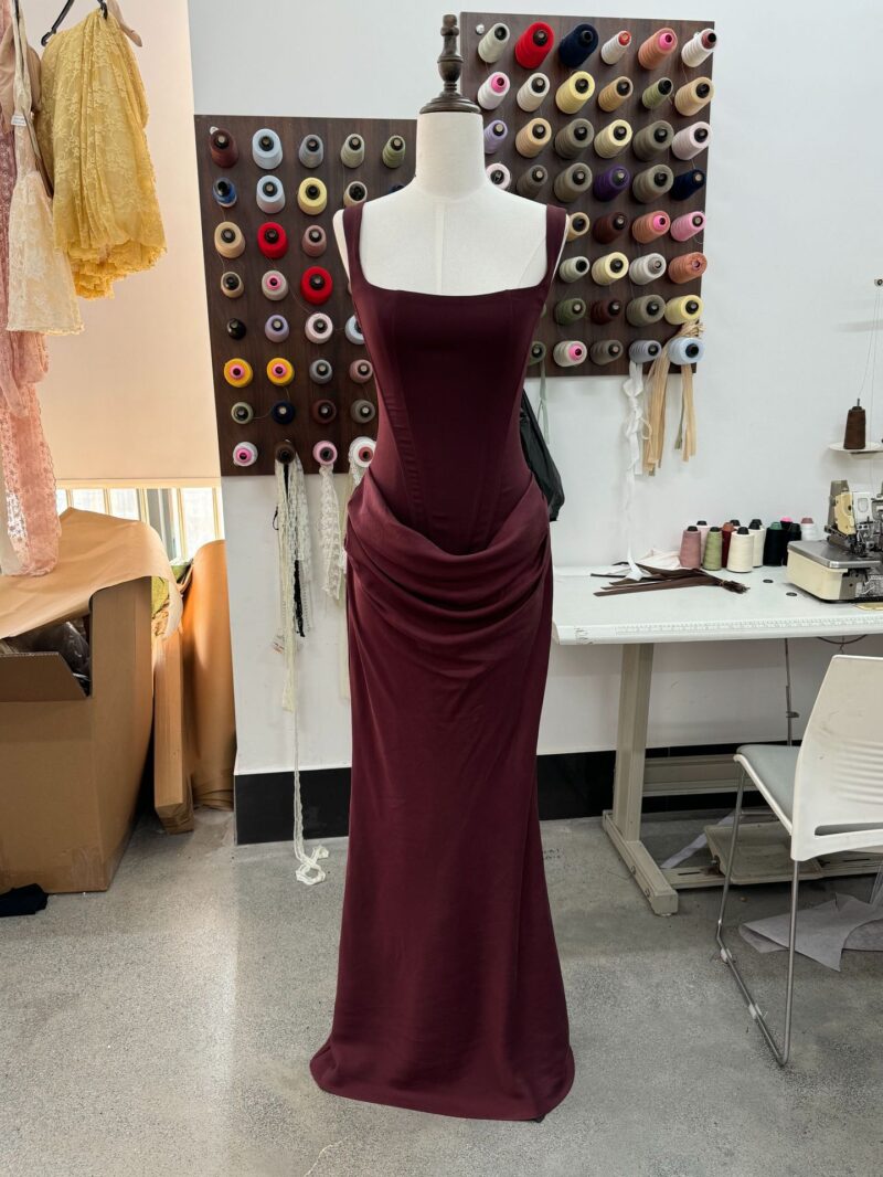 Boned, form-fitting lace-up design with drawstring