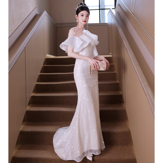 Elegant French-style white fishtail gown.