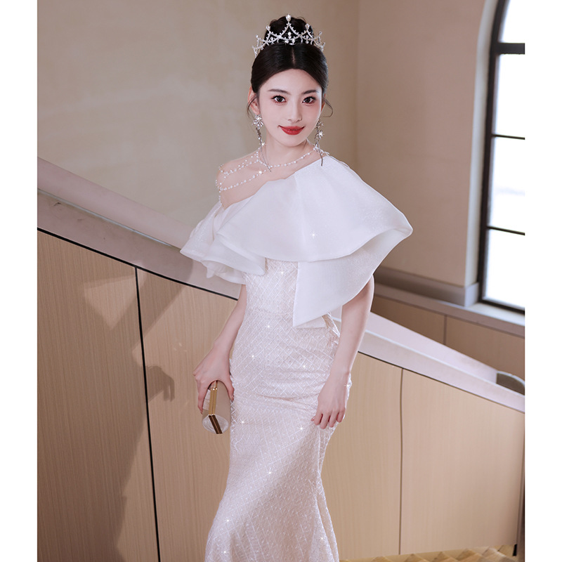 Elegant French-style white fishtail gown.