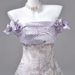 The combination of satin and tulle creates a distinctive style for the product Evening Dress