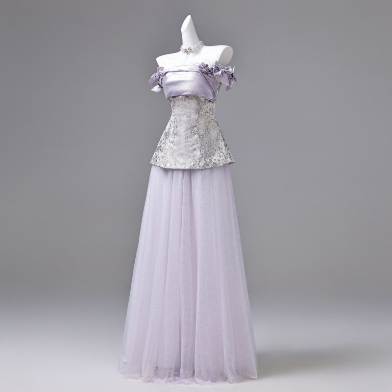 The combination of satin and tulle creates a distinctive style for the product Evening Dress