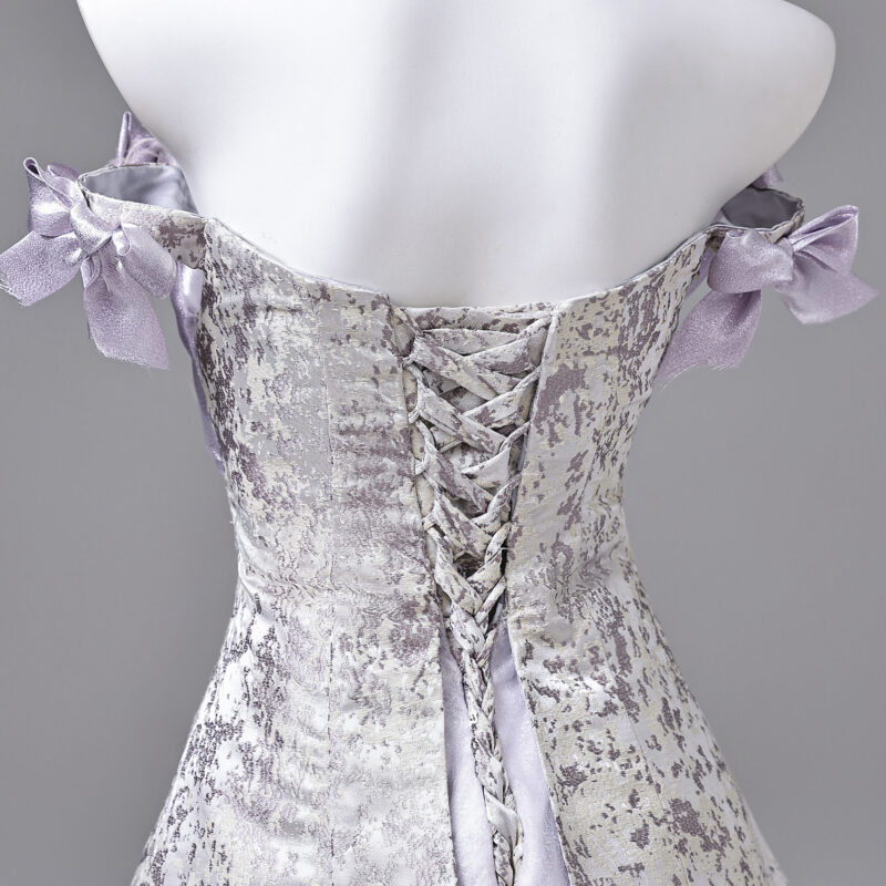 The combination of satin and tulle creates a distinctive style for the product Evening Dress