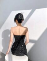 Black off-the-shoulder feather gown